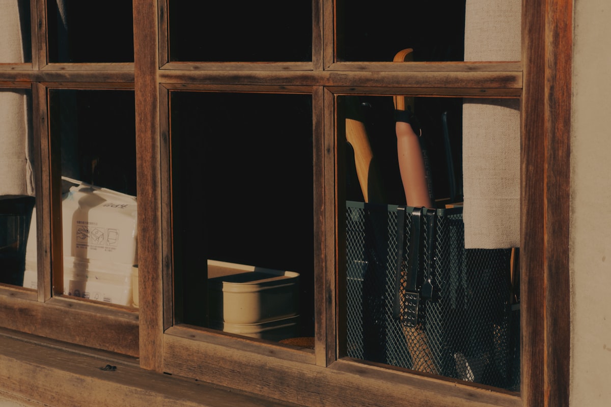 A stack of old notebooks on a windowsill, ready to be reopened and read