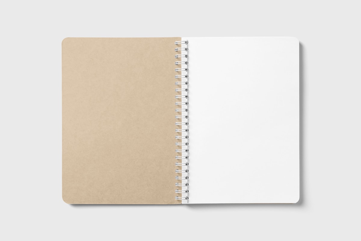 An open notebook with soft light falling across the page, inviting quiet attention