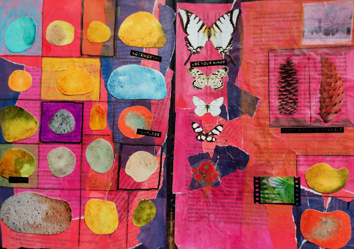 A collage of pressed natural objects and paper butterflies on a soft pink background